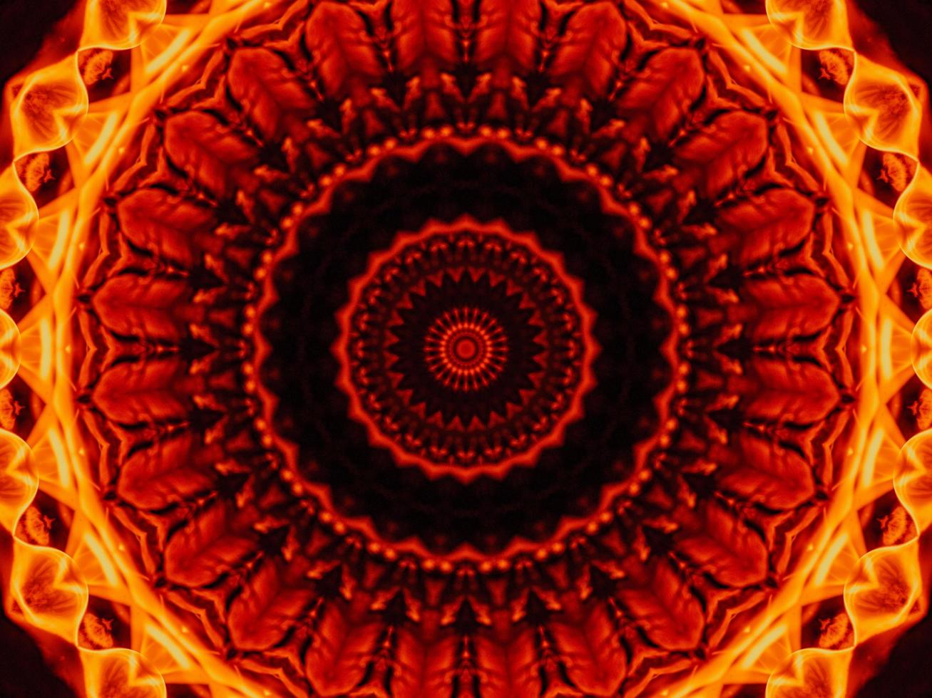 Unique abstract background. Orange flames kaleidoscope pattern. Free Photo