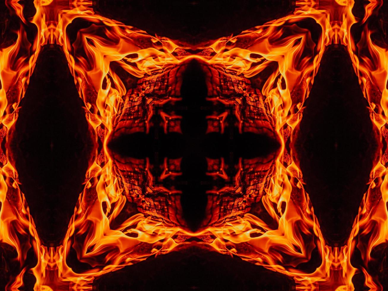 Unique abstract background. Orange flames kaleidoscope pattern. Free Photo