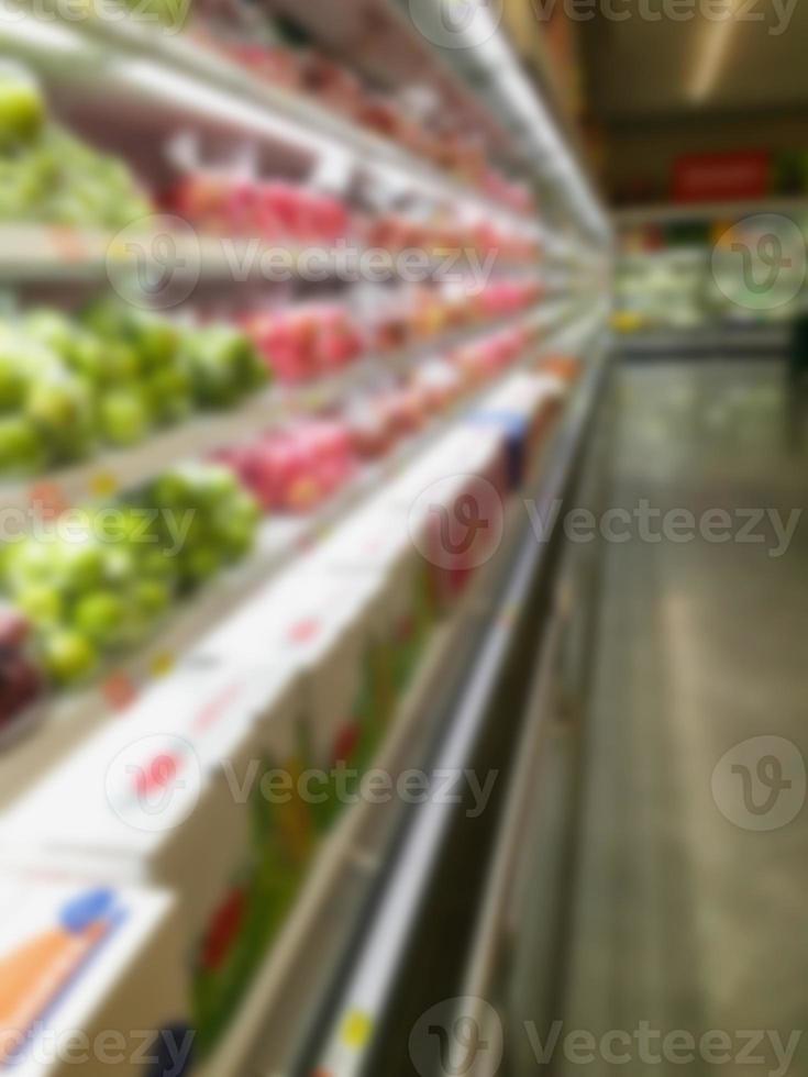 Shelf with fruits in supermarket photo