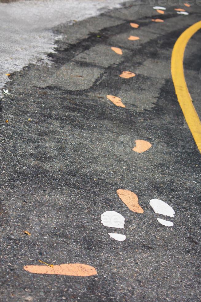 Footprints On Walking Track In The Park photo