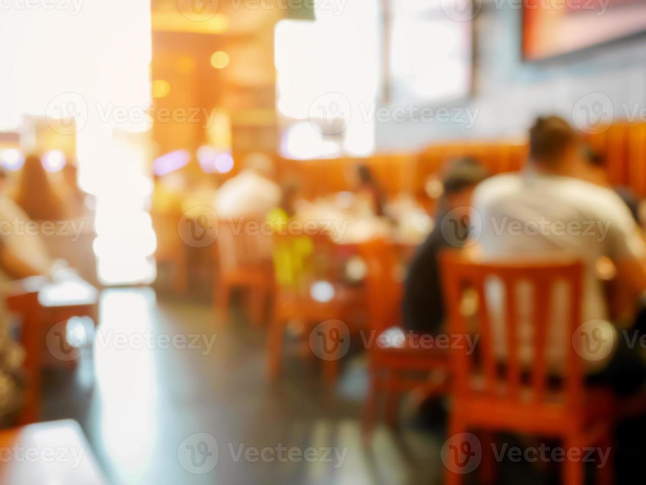 cliente en restaurante desenfoque de fondo con bokeh foto