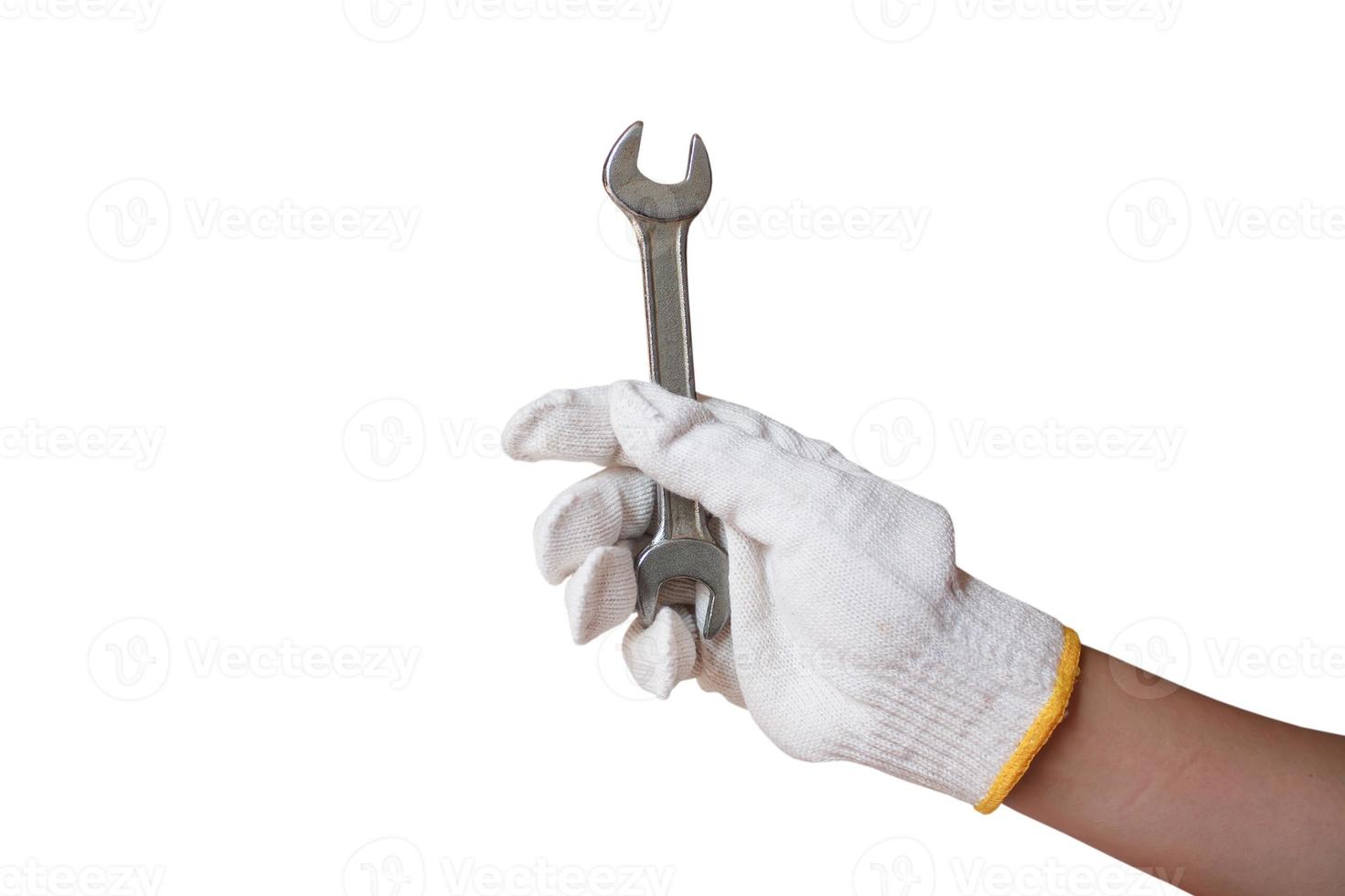 hand holding wrench isolated on white background photo