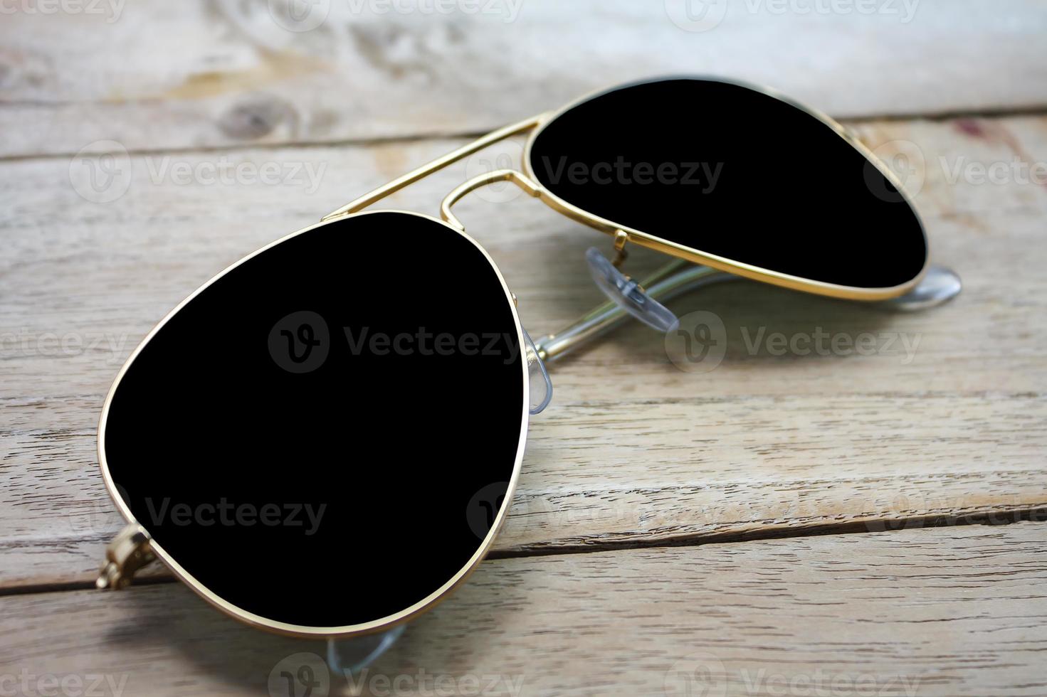 sun glasses on wood photo