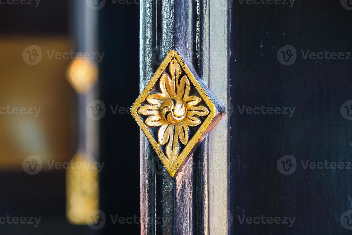 Thai style art flower carving on window photo