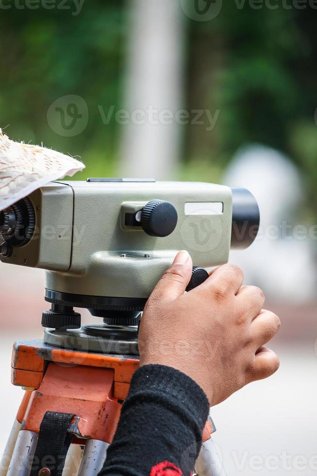 Surveyor equipment theodolite outdoors at construction site photo