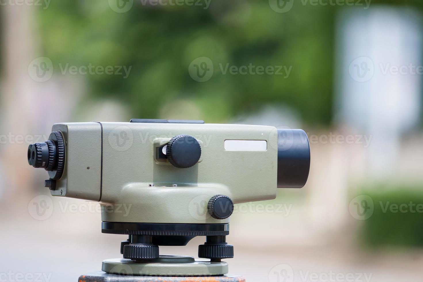 Surveyor equipment theodolite outdoors at construction site photo