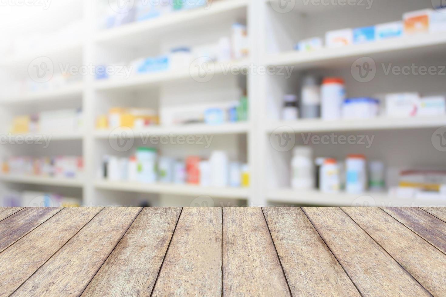 pharmacy product display counter with drugstore shelves photo