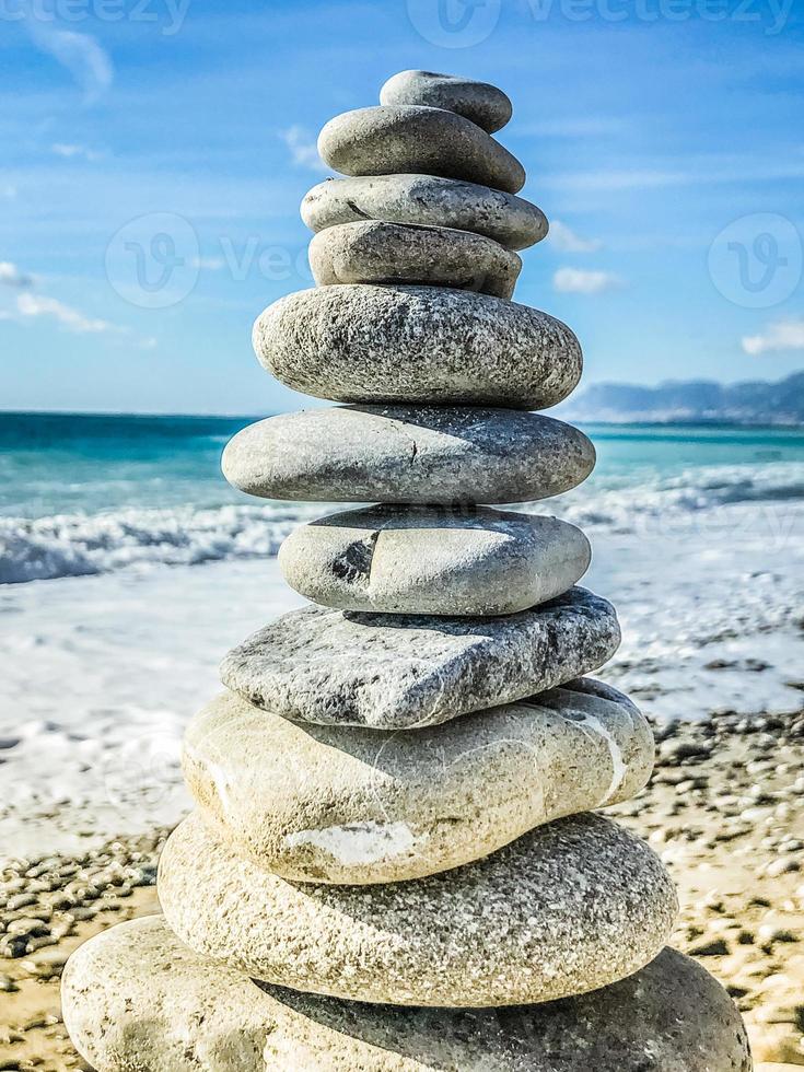 High pebble stack, sea in background photo