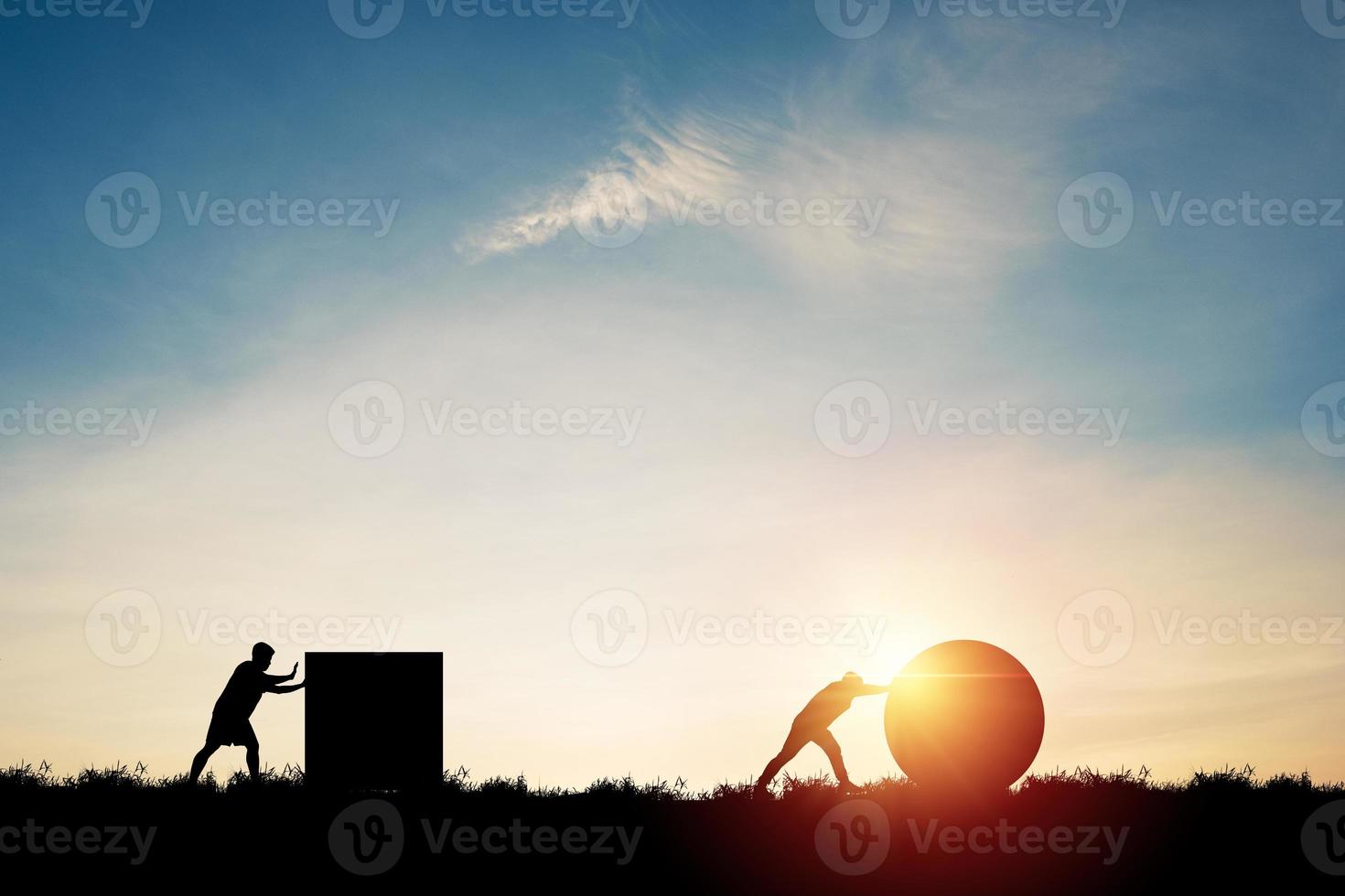 Silhouette of one man pushing circle leading the race against man pushing rectangular icon for smart creative thinking idea and business strategy concept. photo