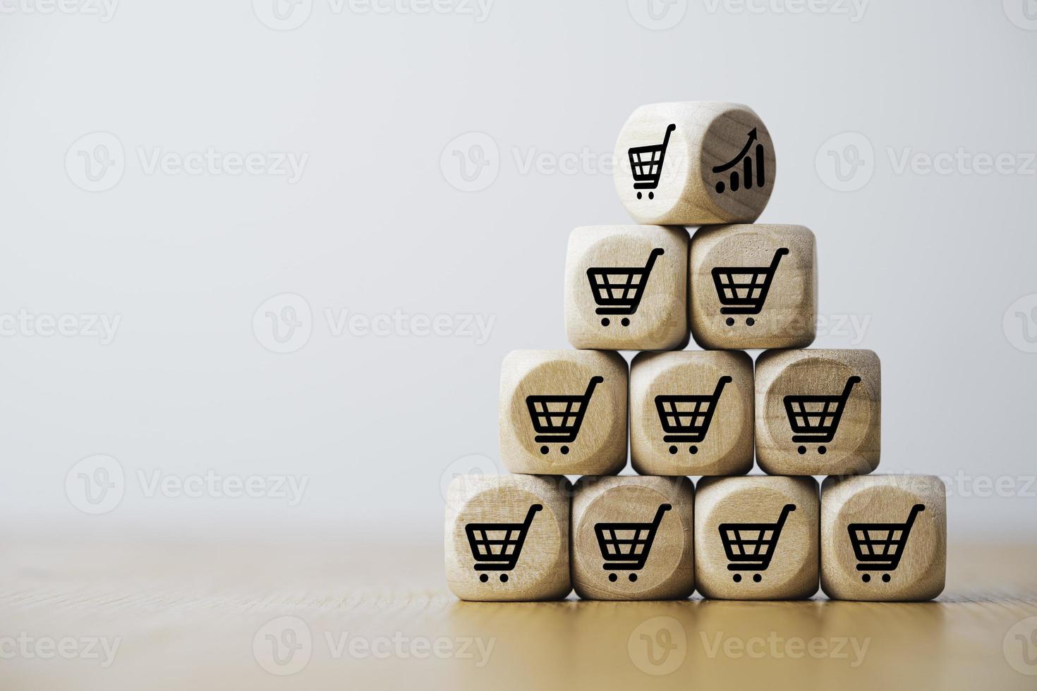 Wooden cube block stacking which print screen shopping trolley cart and investment graph for sale amount increasing and business growth concept. photo
