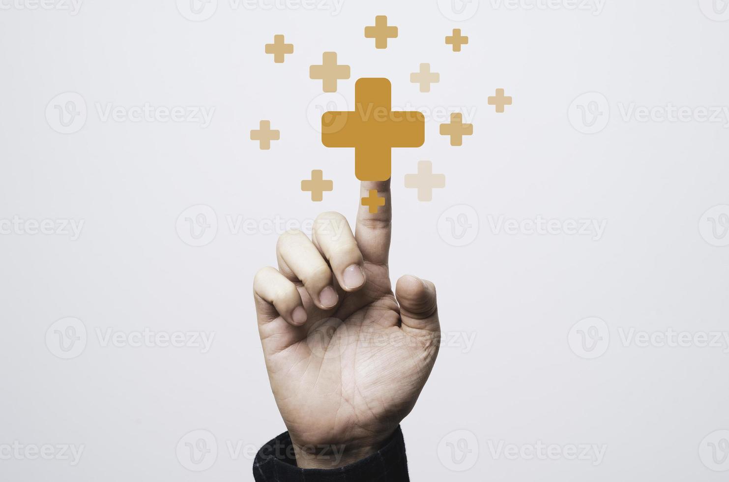 Businessman touching virtual orange plus sign for positive thinking mindset or healthcare insurance symbol concept. photo