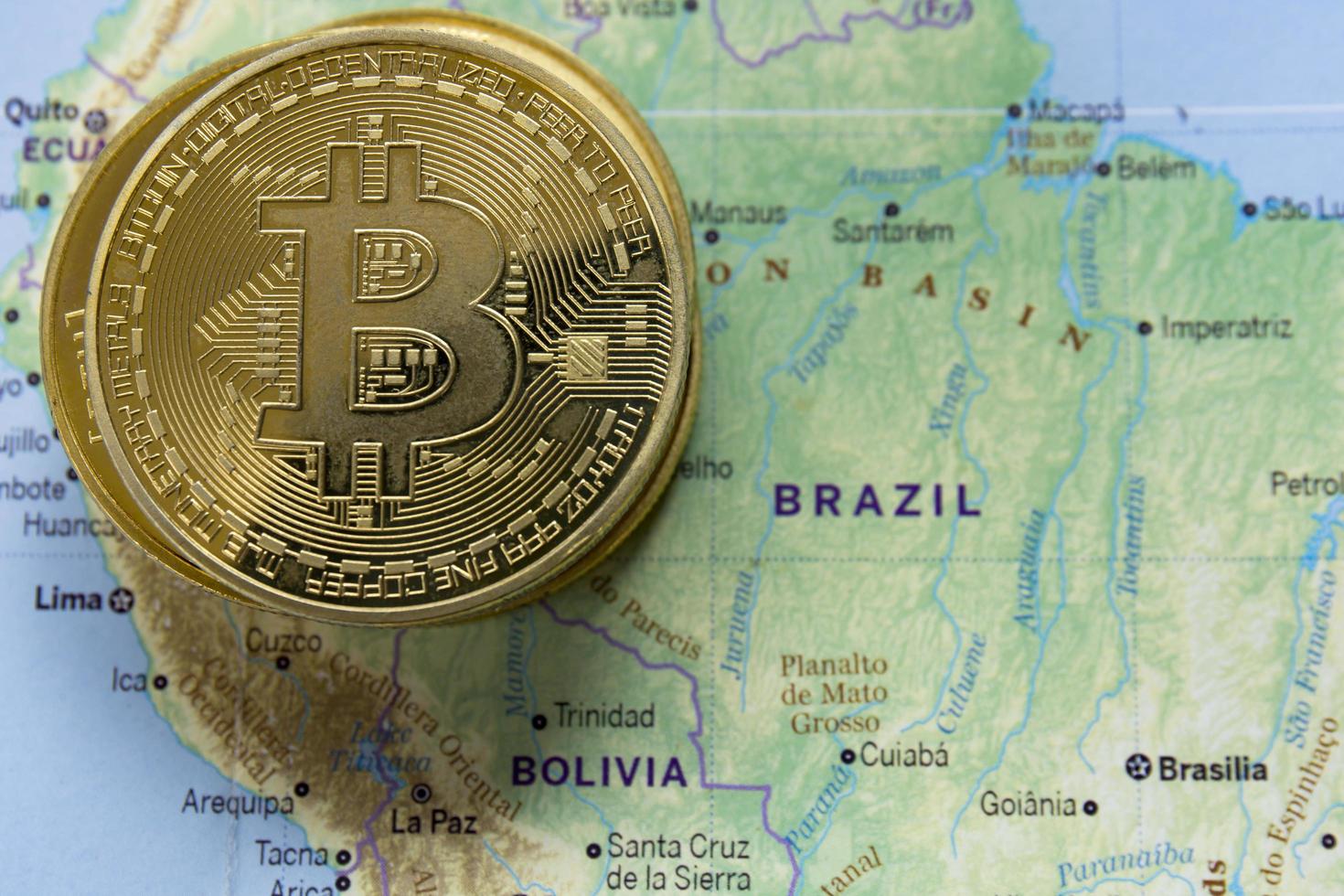 The golden bitcoins were placed on the world map. photo