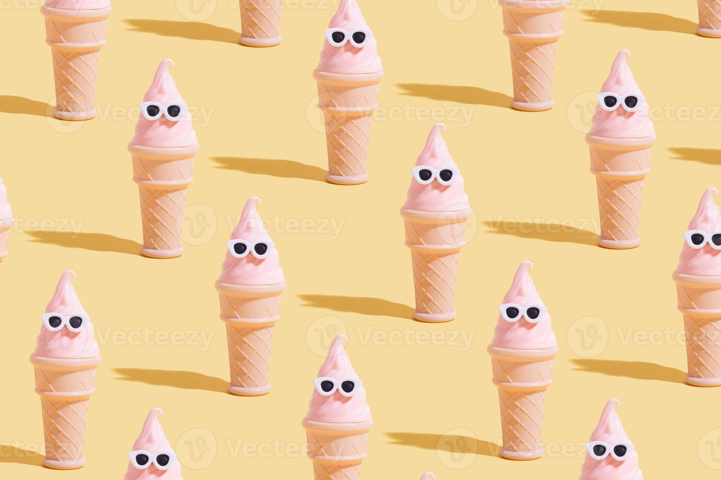 Creative pattern with toy Ice cream cone with sunglasses. Summer vacation in hot weather minimalistic concept photo