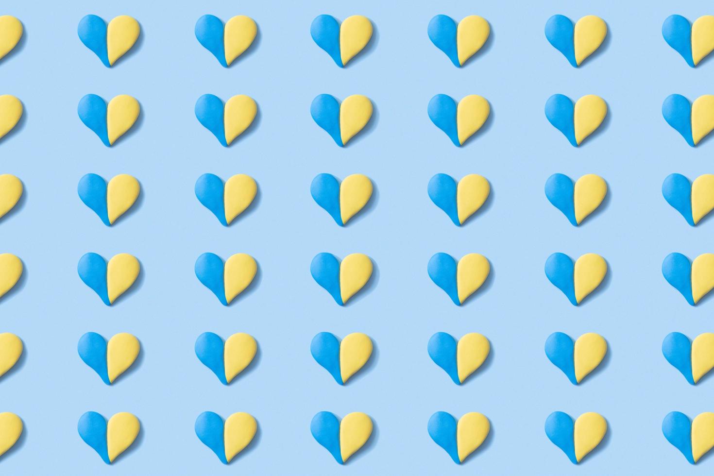 Pattern with many hearts in yellow-blue colors of the Ukrainian flag. Abstract Ukrainian background photo