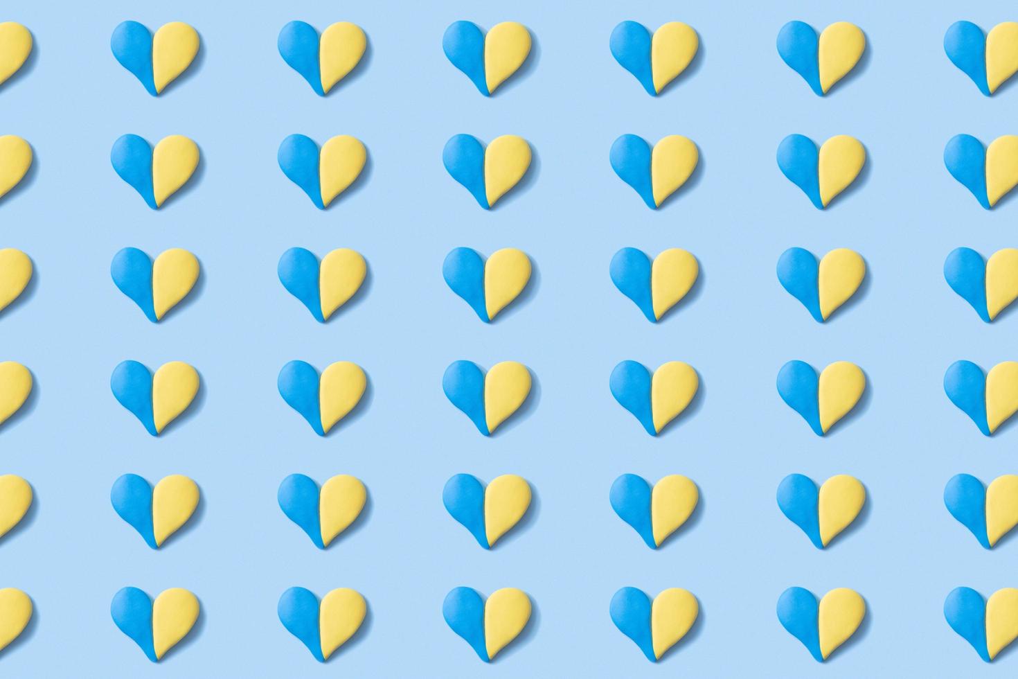 Pattern with many hearts in yellow-blue colors of the Ukrainian flag. Abstract Ukrainian background photo