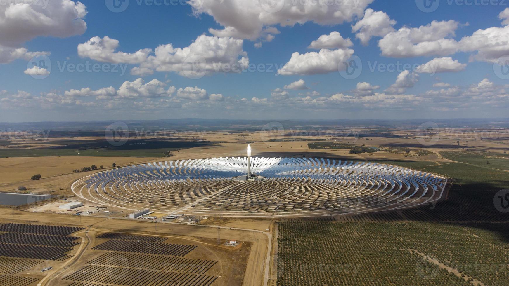 Aerial drone view of Gemasolar Thermosolar Plant in Seville, Spain. Solar energy. Green energy. Alternatives to fossil fuel. Environmentally friendly. Concentrated solar power plant. Renewable energy. photo