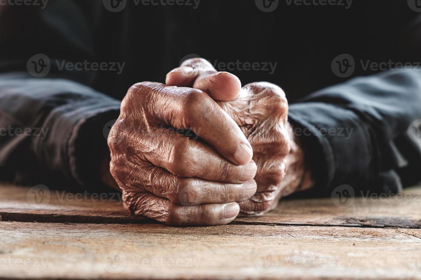 Close up of male wrinkled hands, old man is wearing photo