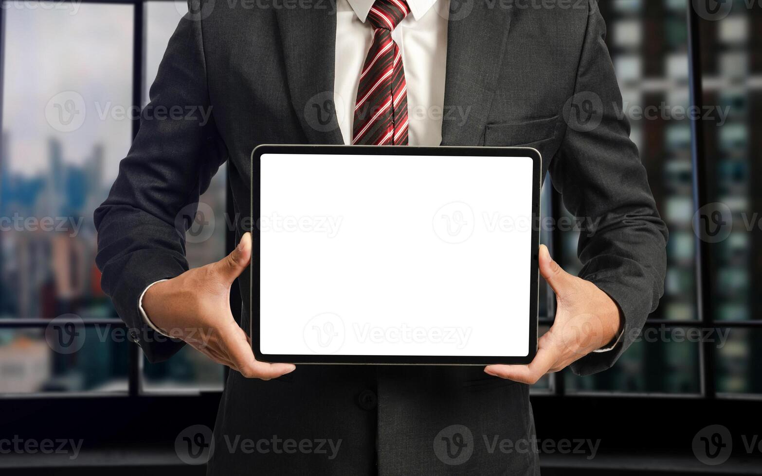 Business man holding and shows touch screen tablet with digital device, technology for smart working concepts photo