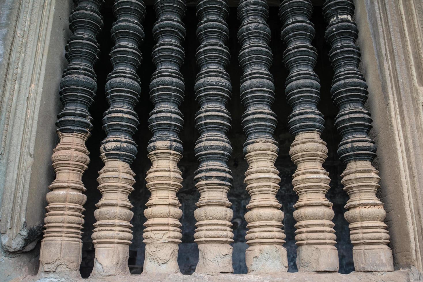 The old window made by stone in ancient Khmer temple in Siem Reap, Cambodia. photo