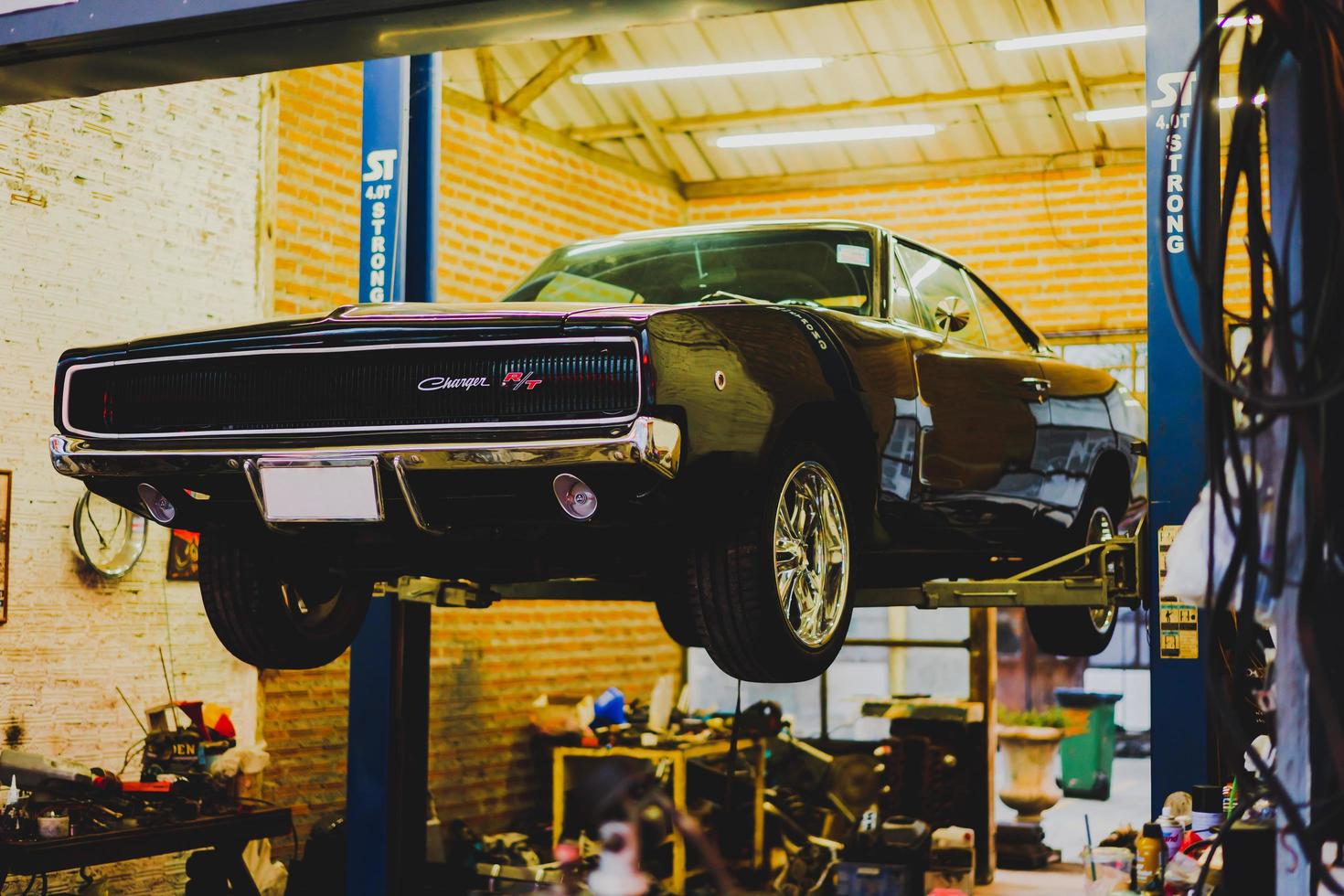 Bangkok, Thailand - 31 October 2021 - Vintage car on beam repaired in garage. photo