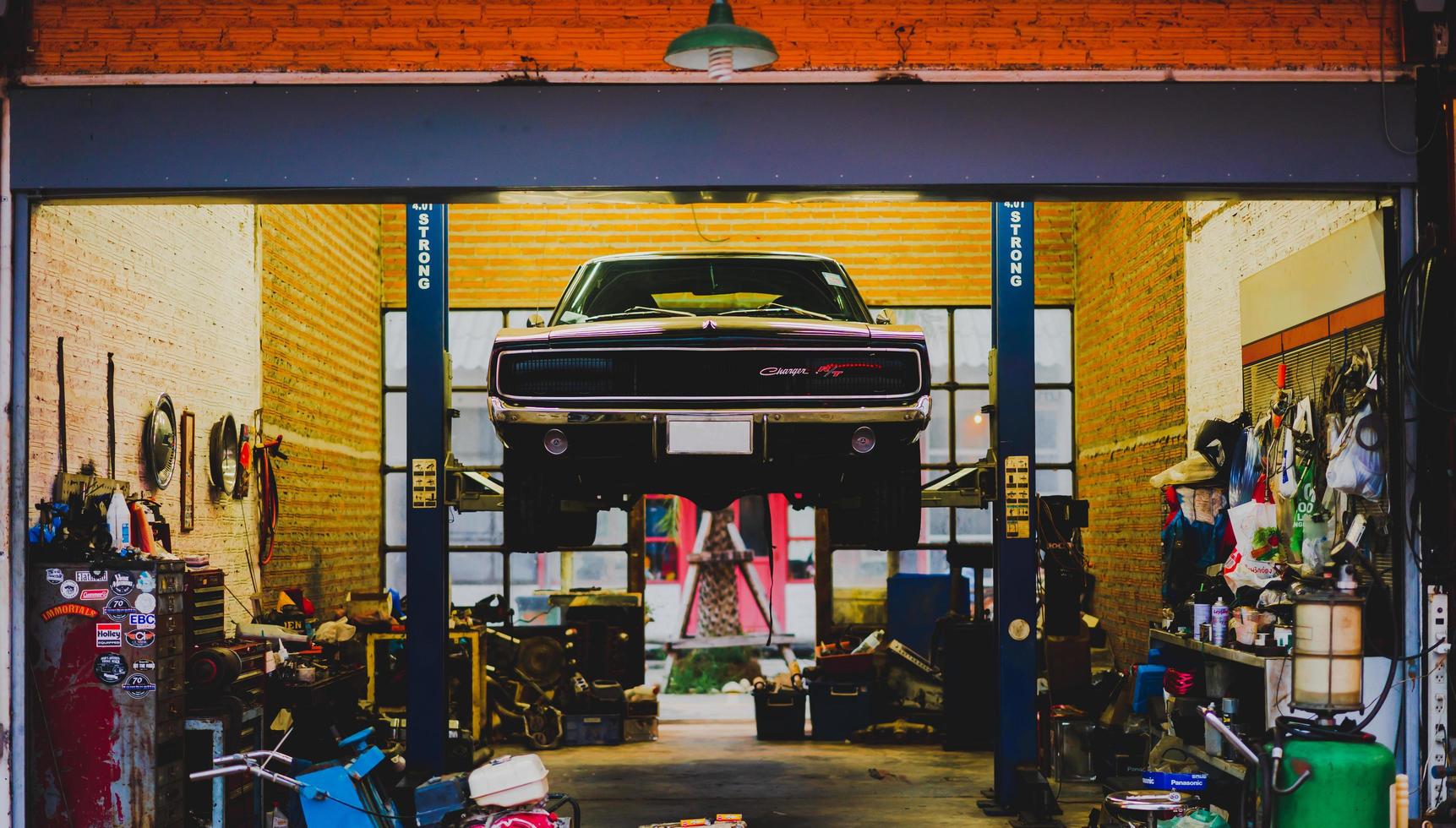 Bangkok, Thailand - 31 October 2021 - Vintage car on beam repaired in garage. photo