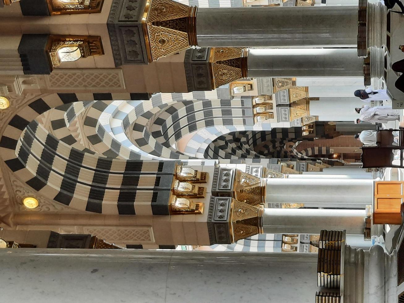 Madinah, Saudi Arabia, Dec 2021 - Visitors from all over the world are busy remembering Allah in different parts of Prophets Mosque Madinah. photo