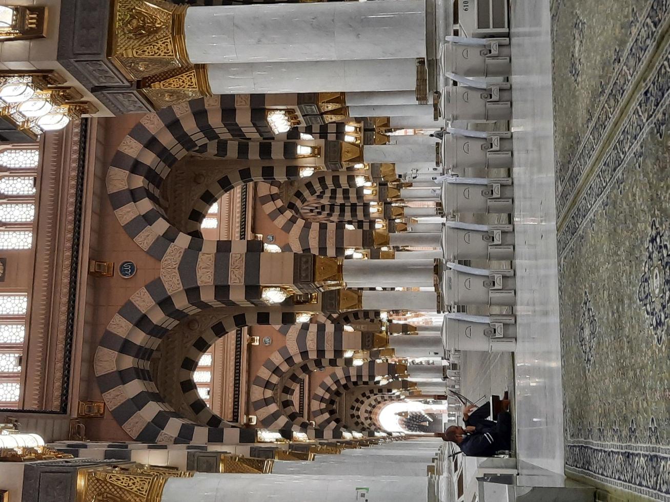 Madinah, Saudi Arabia, Dec 2021 - Visitors from all over the world are busy remembering Allah in different parts of Prophets Mosque Madinah. photo