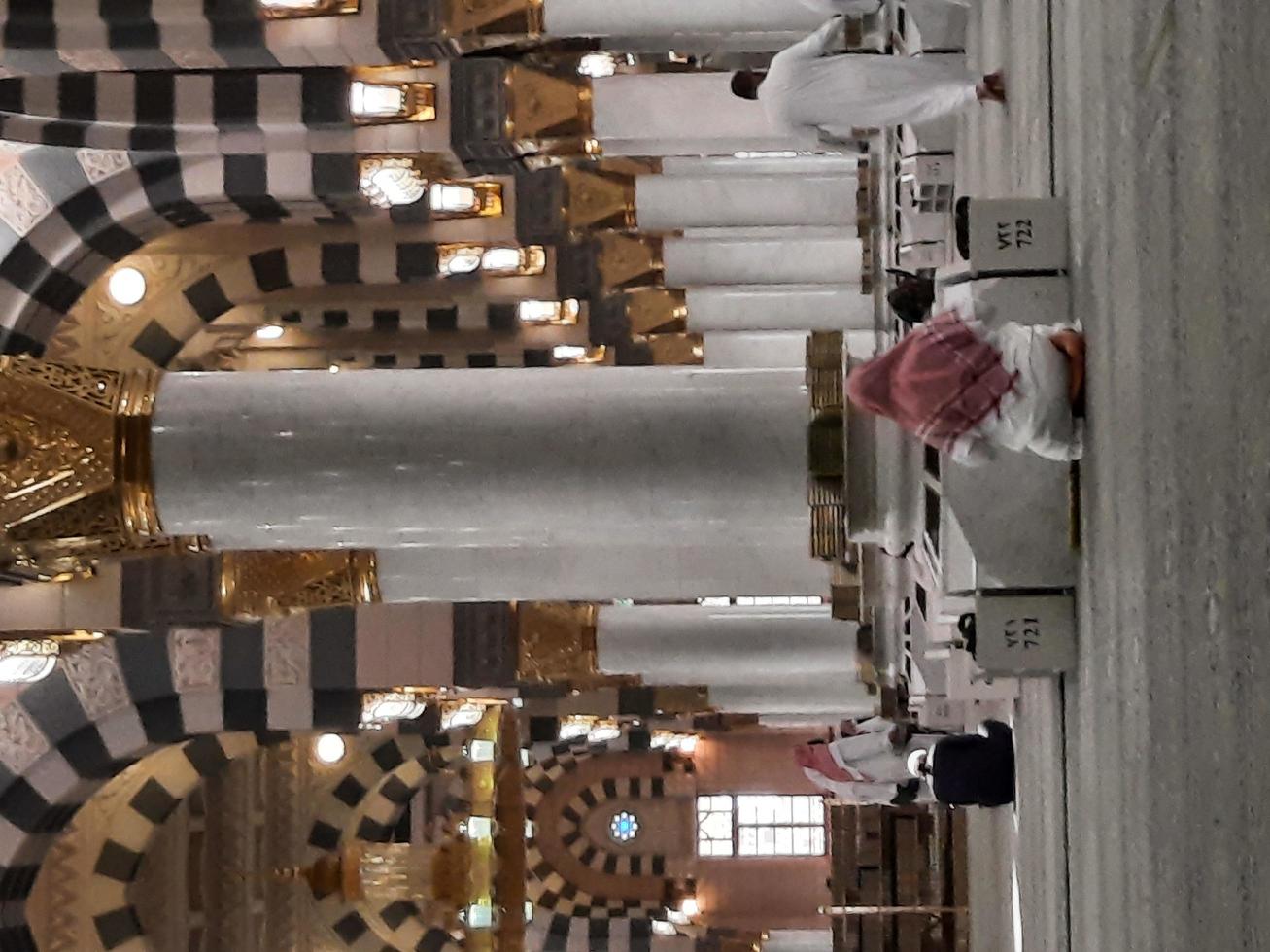 Madinah, Saudi Arabia, Dec 2021 - Visitors from all over the world are busy remembering Allah in different parts of Prophets Mosque Madinah. photo