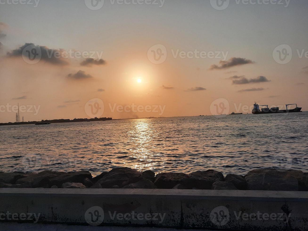 Beautiful Sunset at Male Beach, Maldives photo