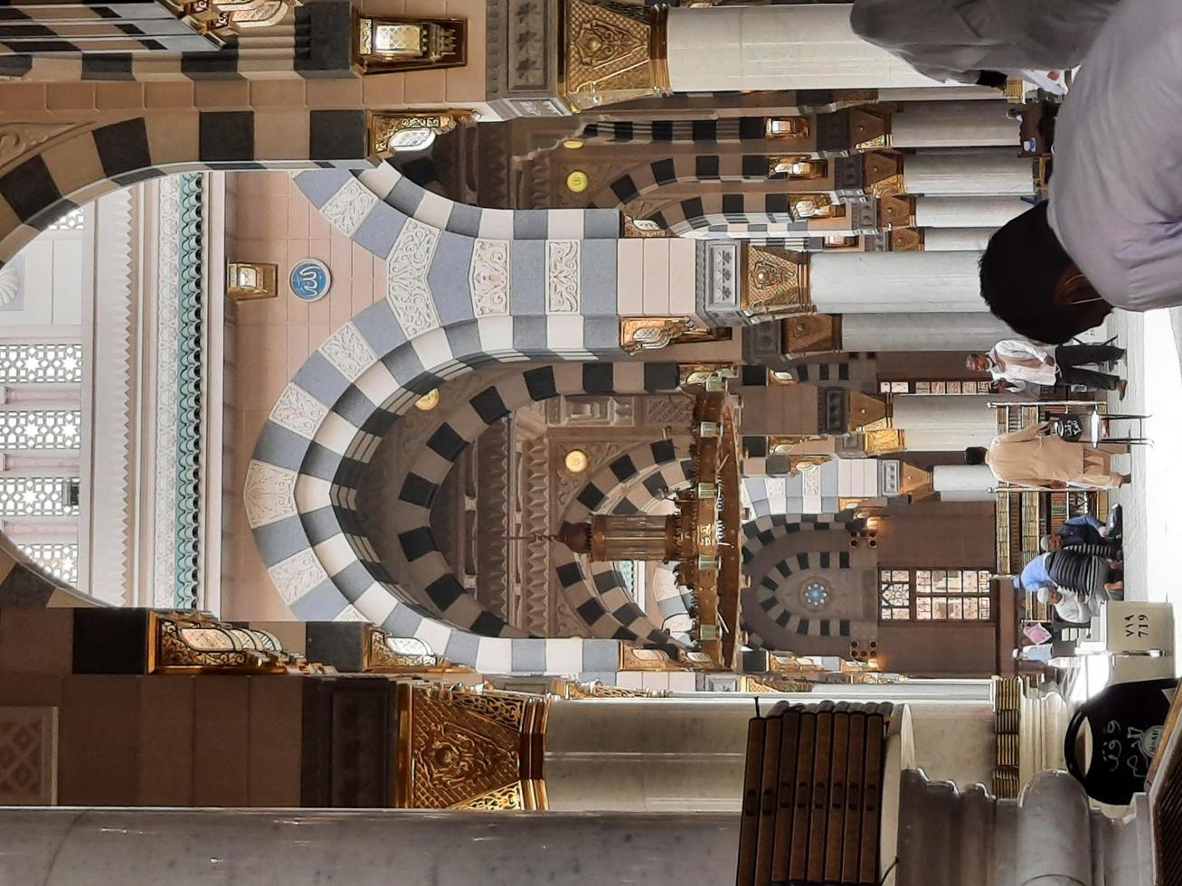 Madinah, Saudi Arabia, Dec 2021 - Visitors from all over the world are busy remembering Allah in different parts of Prophets Mosque Madinah. photo