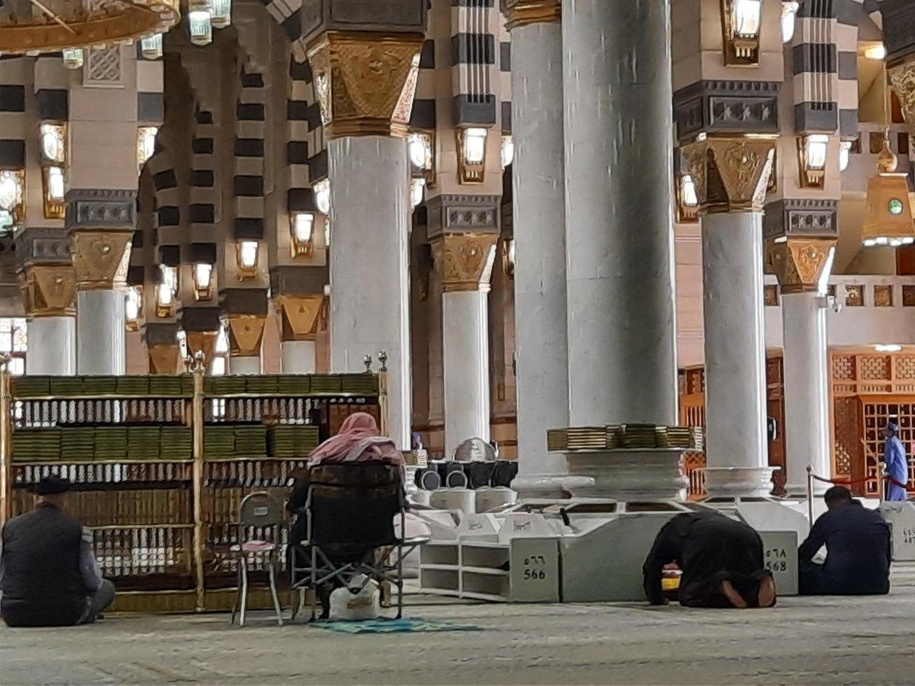 Madinah, Saudi Arabia, Dec 2021 - Visitors from all over the world are busy remembering Allah in different parts of Prophets Mosque Madinah. photo