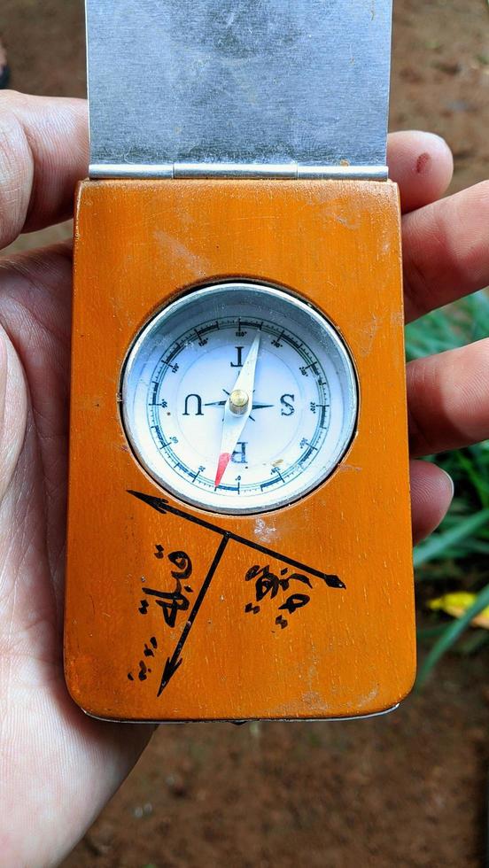 Compass to determine the Qibla direction of Indonesian Muslim graves.  The text in the photo means, Qibla and grave