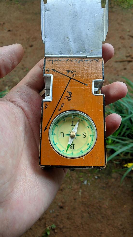 Compass to determine the Qibla direction of Indonesian Muslim graves.  The text in the photo means, Qibla and grave