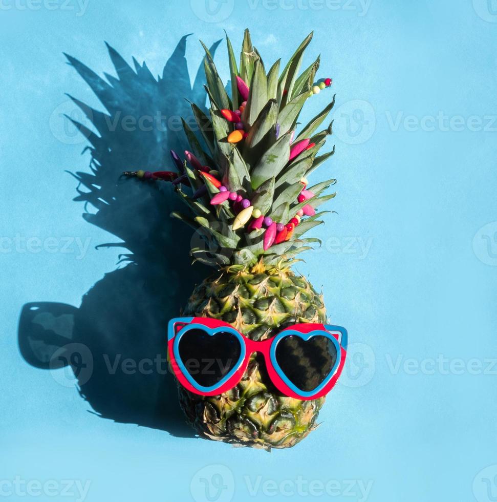 Pineapple hipster in sunglasses. Minimal concept, summer tropical pineapple.Summer, vacation, party photo