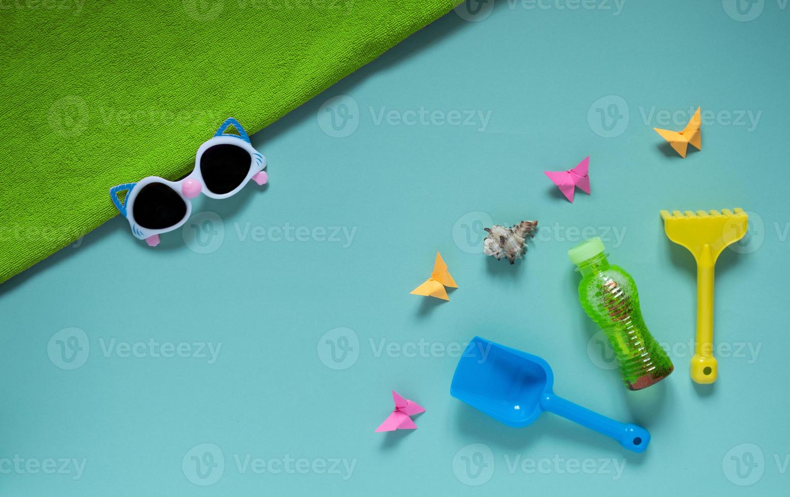 Set of baby beach accessories on light background photo