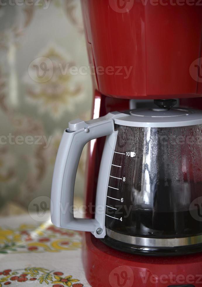 Glass coffee jug with a drink on a white background photo