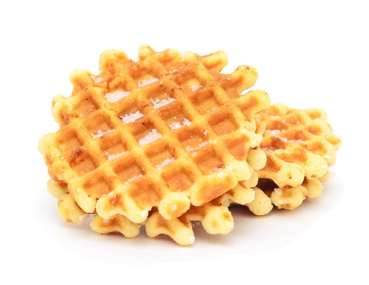 Several Belgian waffles with sugar isolated on a white background. photo