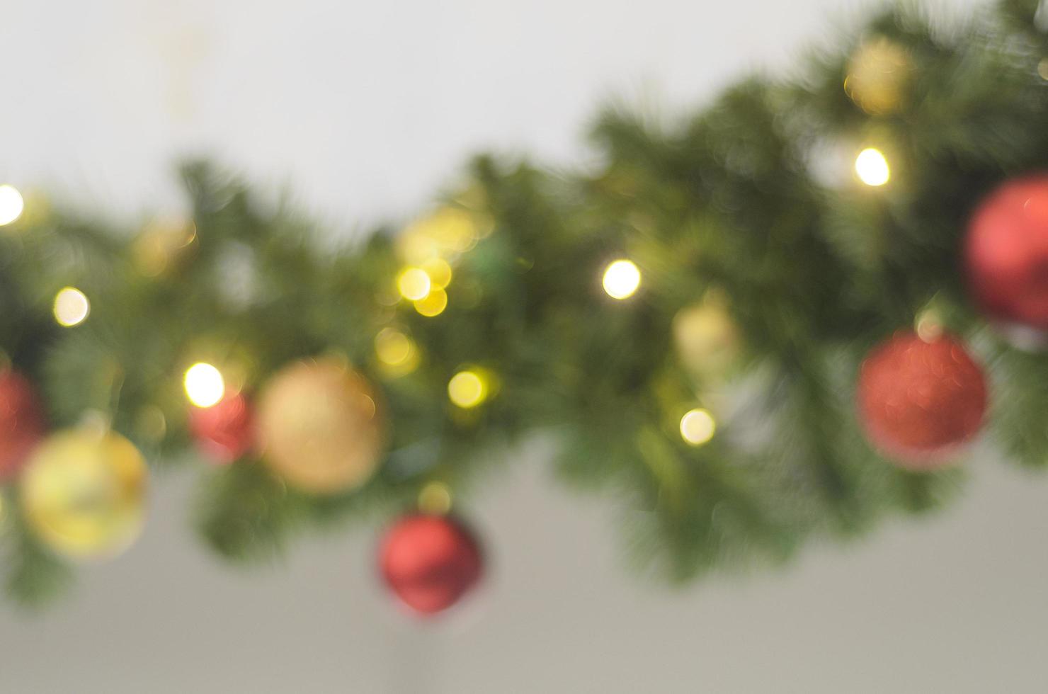 christmas blurred background with christmas wreath out of focus. photo