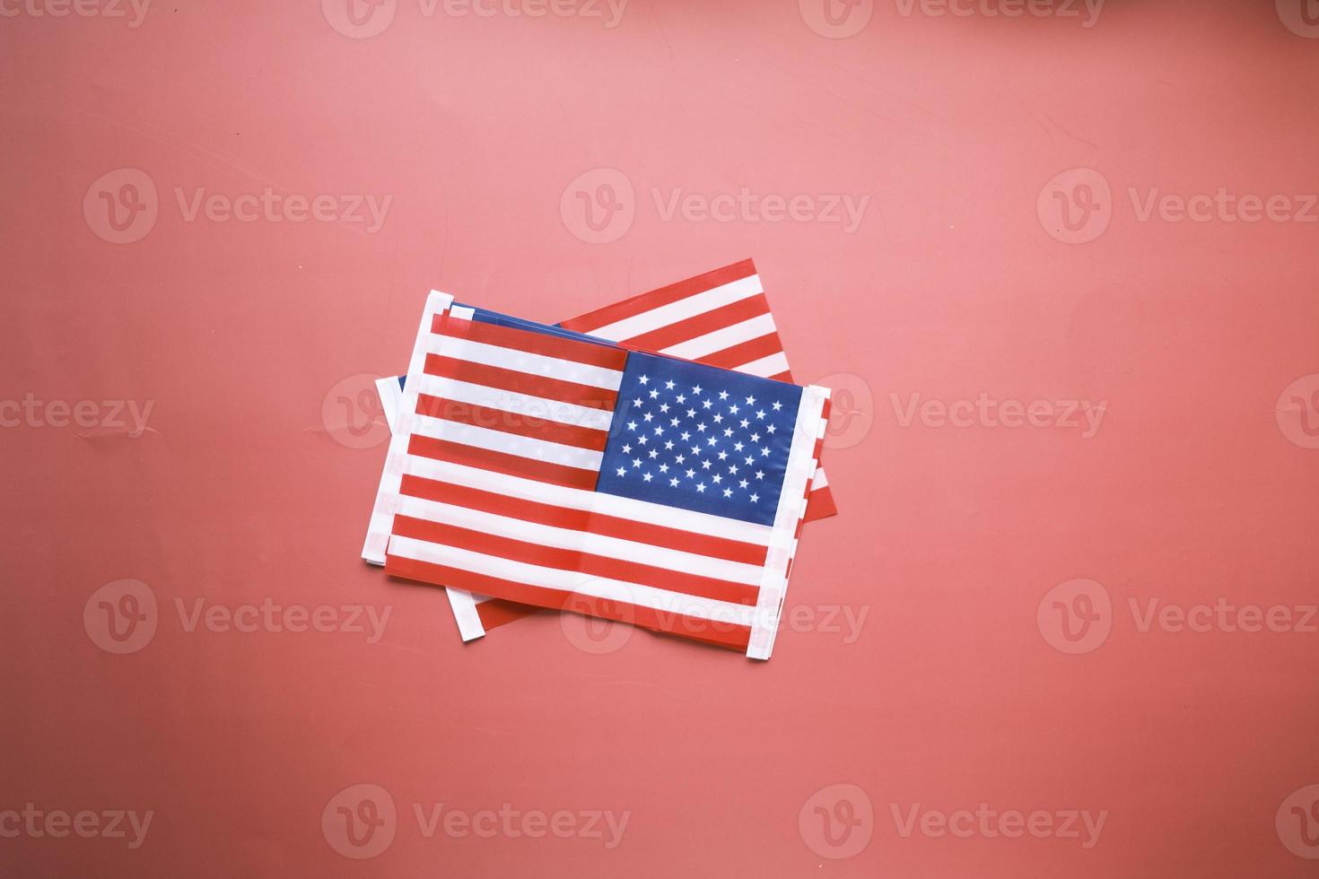 American flag on red background top view photo