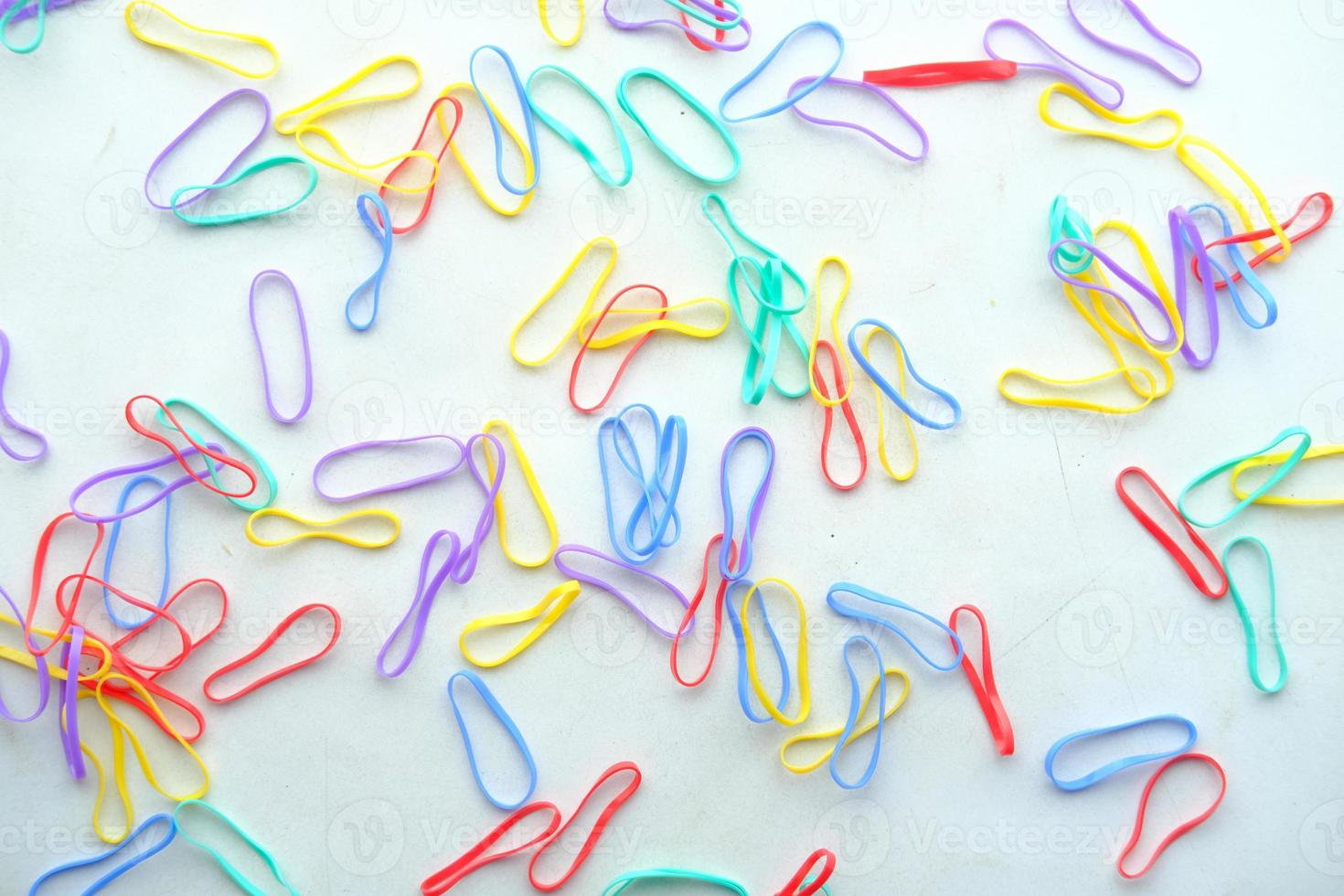 rainbow color Rubber bands on color background photo