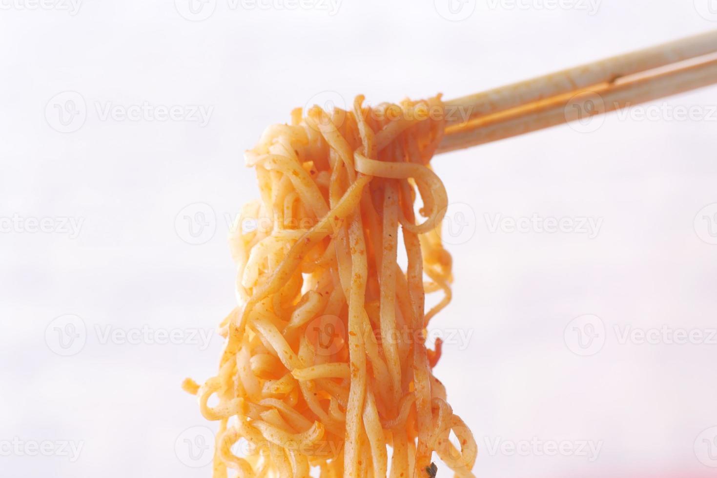 noodles with chopsticks on white background photo