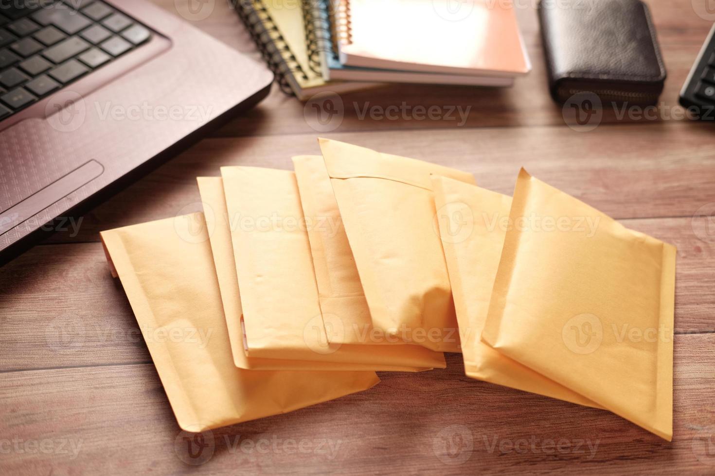 yellow paper bubble envelope on table photo