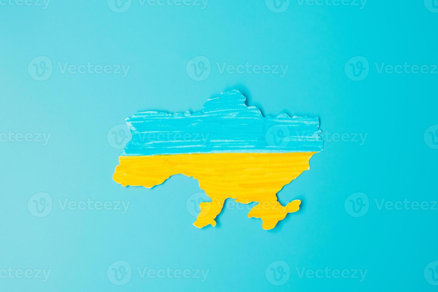 Support for Ukraine in the war with Russia,  the shape of Ukraine border with color flag. Pray, No war, stop war and stand with Ukraine photo