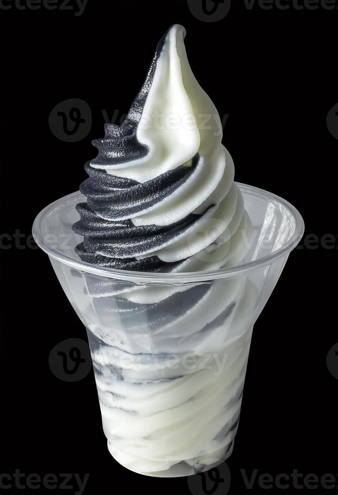 Yoghurt and charcoal soft serve ice cream isolated. photo