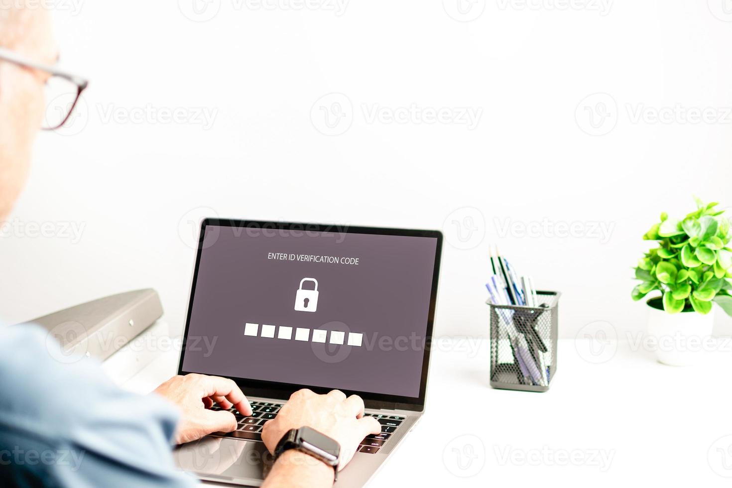 Laptop screen showing login for security system. Concept work at home with computers and Internet. Men typing keyboard key to use computer network. Notebook computer on a white table. blur background photo