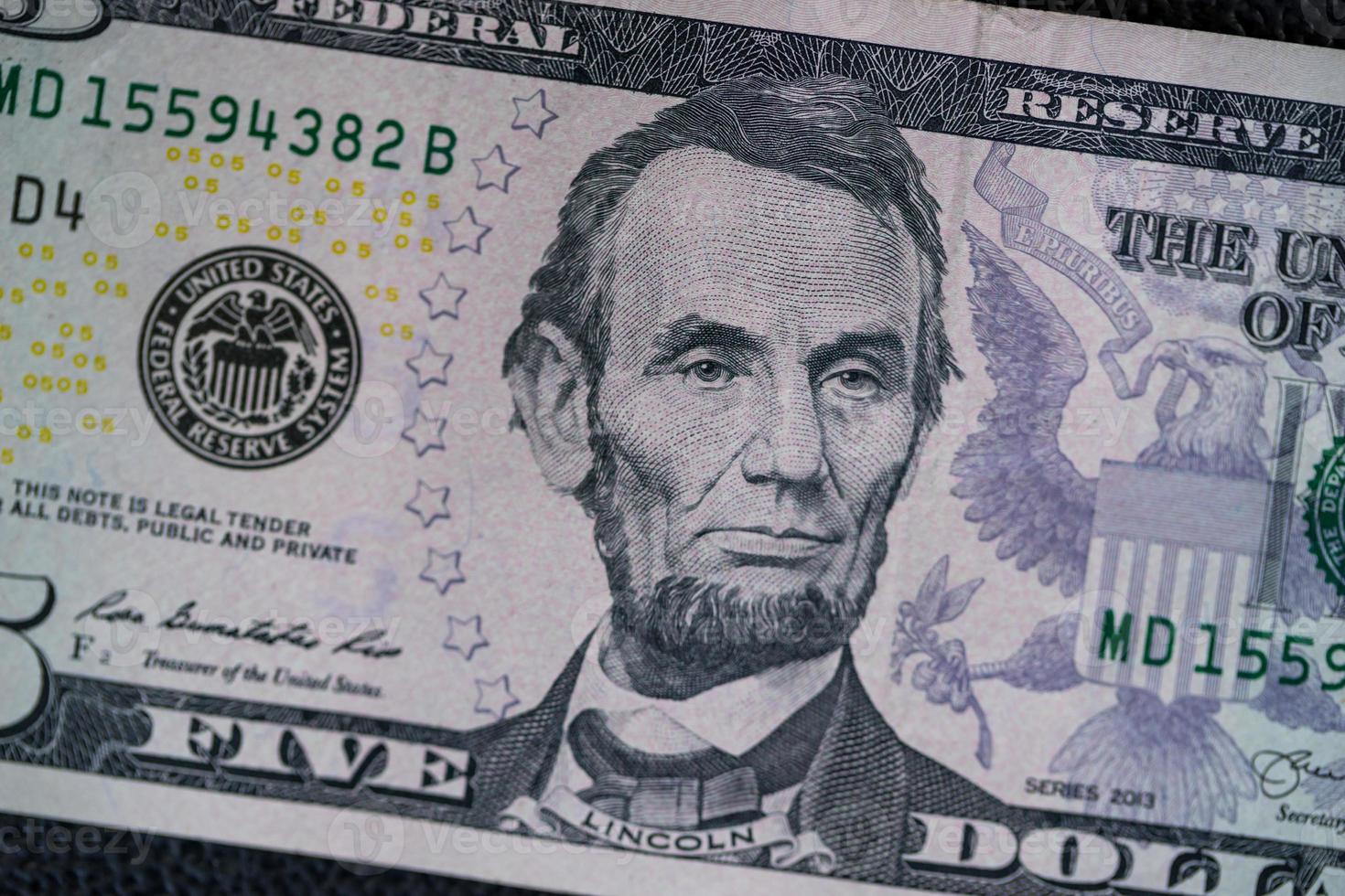 US Dollars on black background. photo