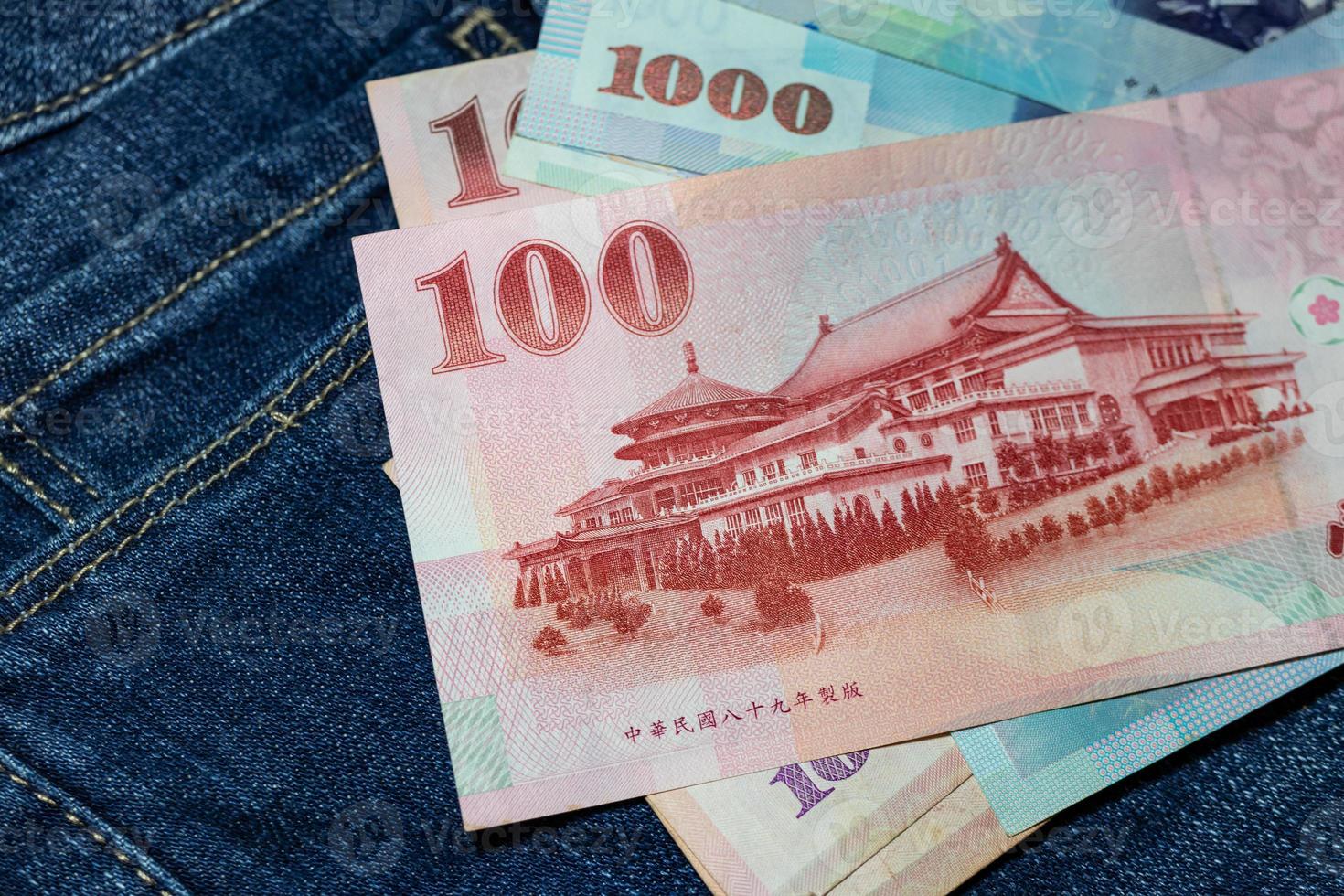 Taiwanese money, Taiwan Banknote, Taiwan dollar on jean background. photo