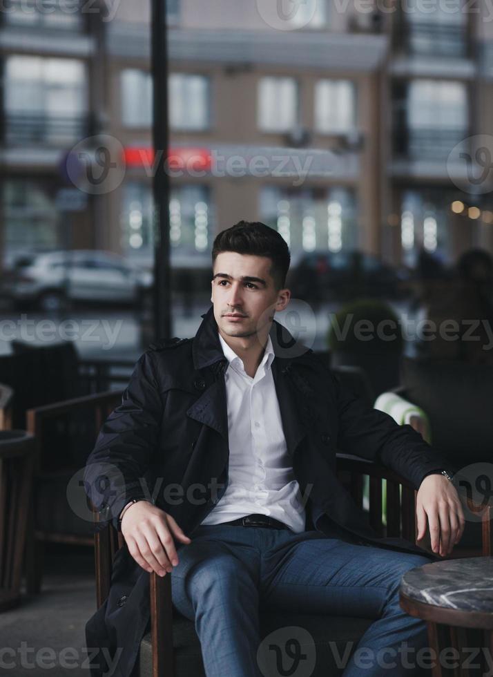 intelligent man sitting restaurant outdoors photo