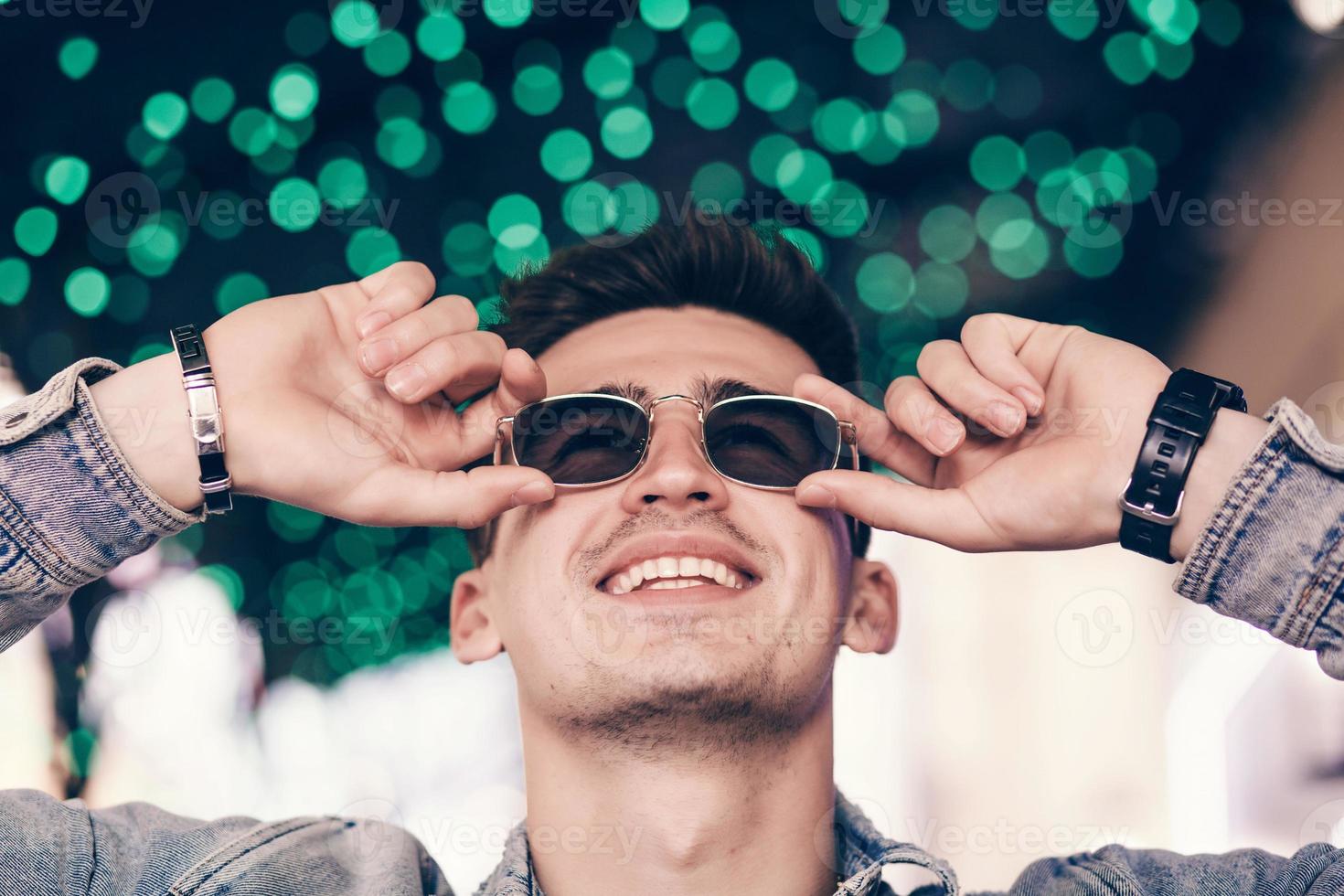 man smiling with glasses photo