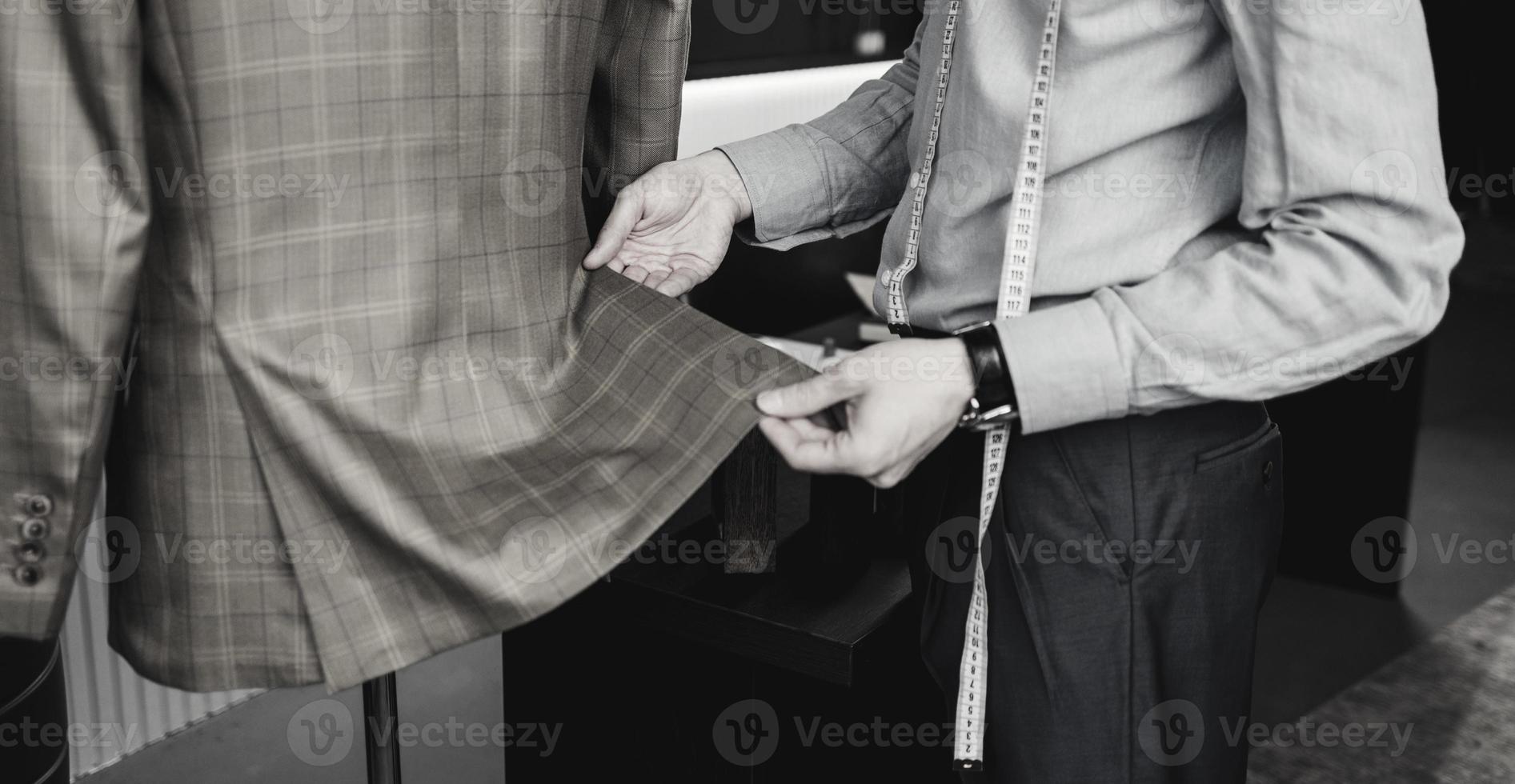 tailor man with a measuring tape photo
